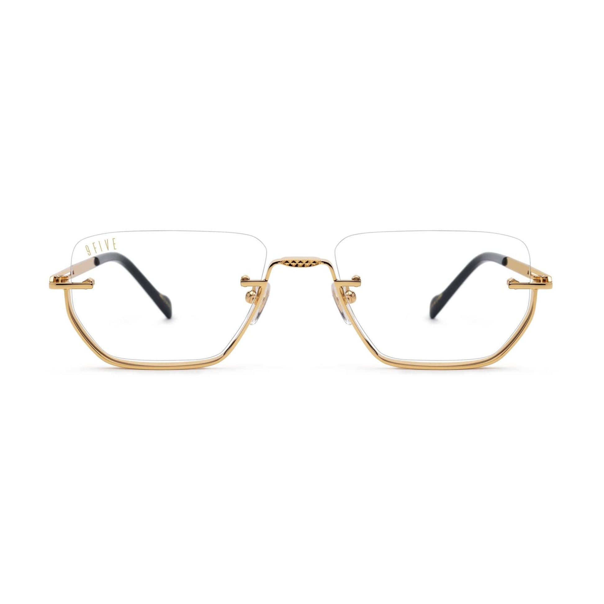 Gold-framed eyeglasses on a white background